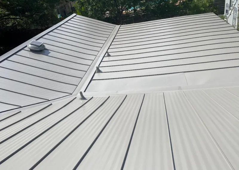 Solar attic fan installed on a metal roof for Roof Ventilation in Northridge
